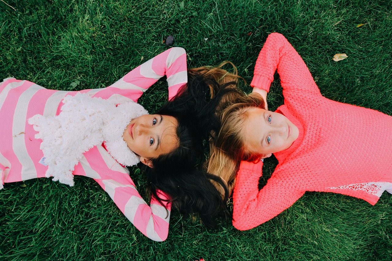 Students lying on grass